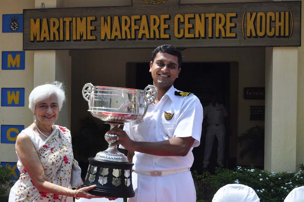 Lieutenant Commander Abhishek Yadav receiving Admiral Hiranandani Rolling Trophy