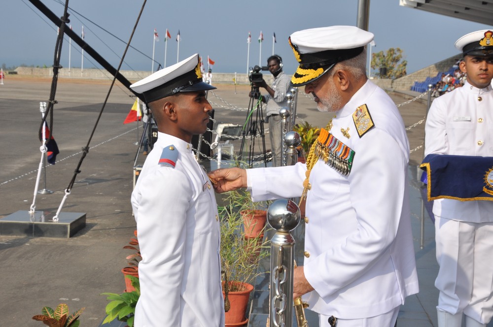 Chief of the Naval Staff, Admiral DK Joshi awarding ‘Presidents Gold Medal’, for the cadet adjudged first in the overall order-of-merit of the INAC course to Squadron Cadet Captain Kiran T Anil