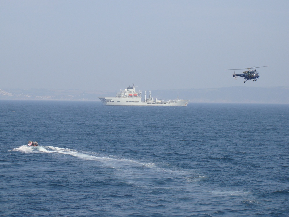 Ship's Boats making approach for Boarding Exercise and Helo for Surveillance