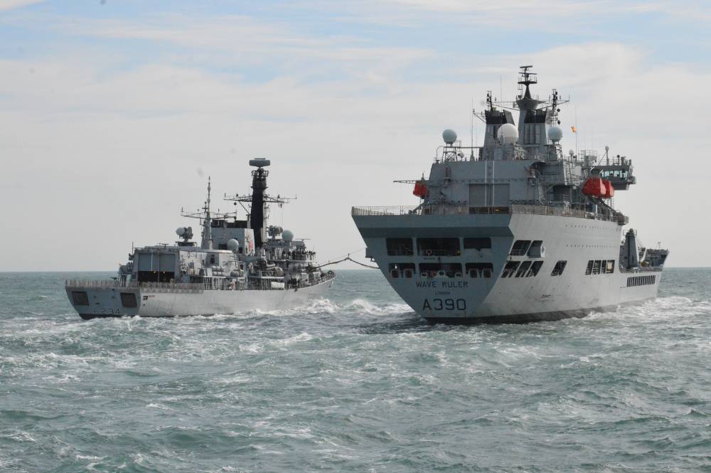 HMS Iron Duke connecting up with RFA Waveruler