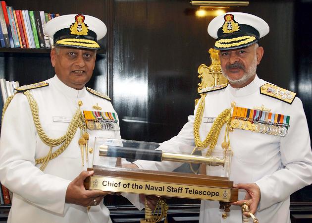 Admiral DK Joshi the new CNS being presented with a ceremonial Telescope by Outgoing CNS Admiral Nirmal Verma at South Block, New Delhi