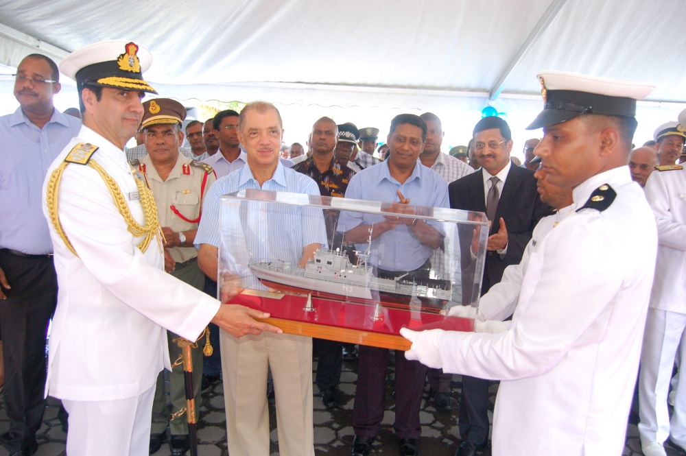 Admiral RK Dhowan, Chief of the Naval Staff (IN), presenting a model of INS Tarasa to Mr. James Alix Michel President of the Republic Seychelles